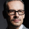 Portrait of trendy man wearing Adlens Focuss glasses