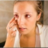 Woman using contact lens