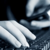 Woman typing on keyboard