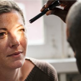 caucasian woman getting eye exam