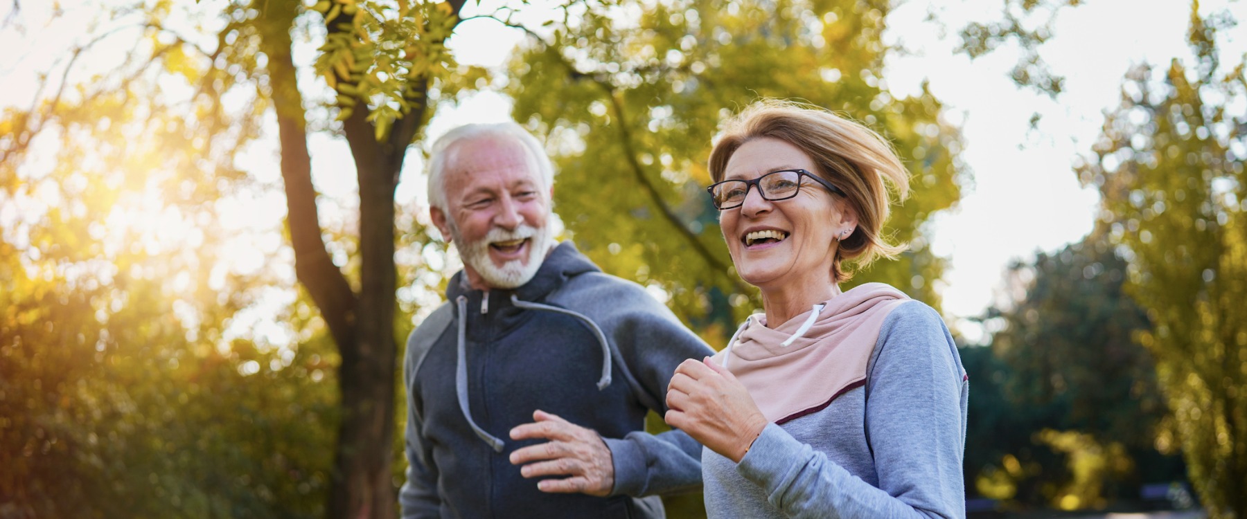 Happy senior couple jogging