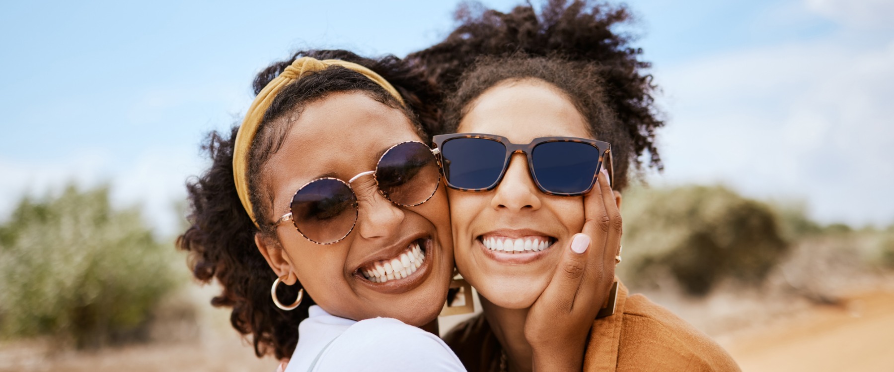 Traveling couple of women smiling