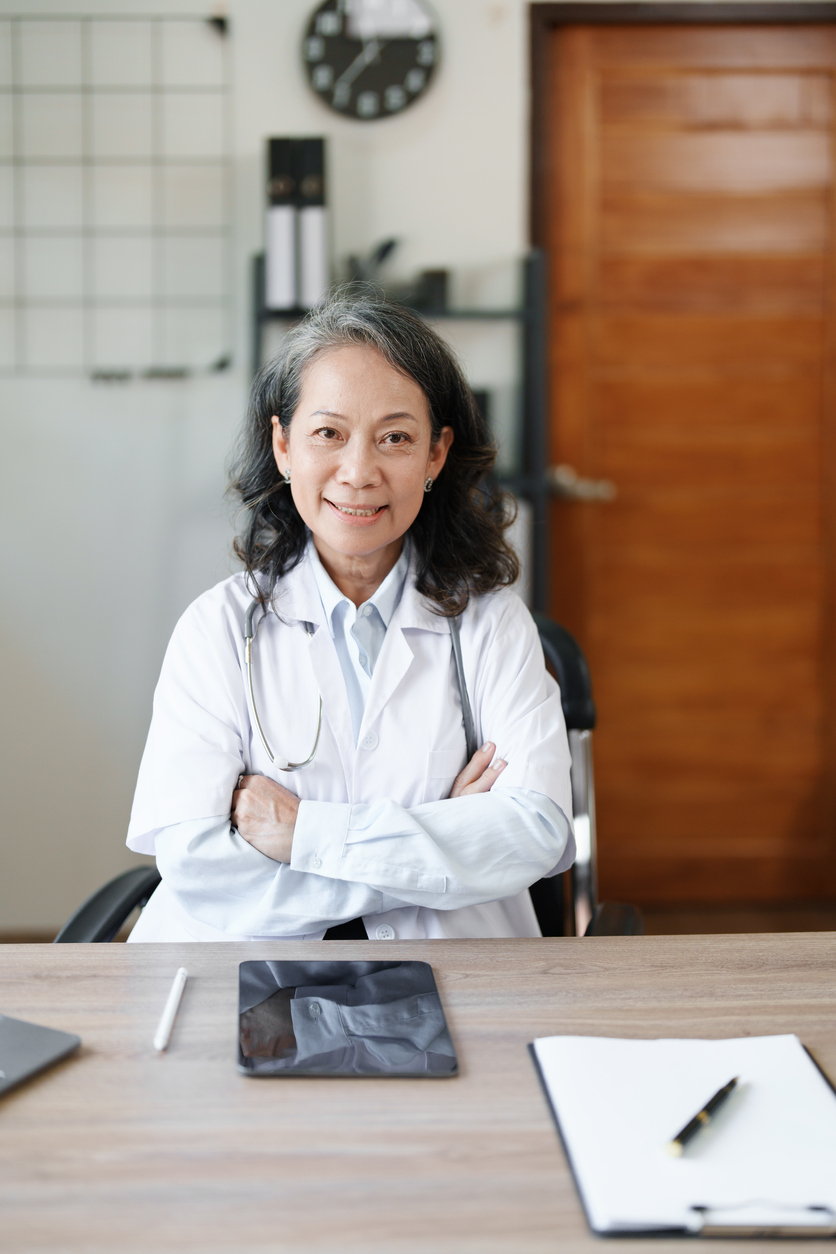 Doctor smiling at desk