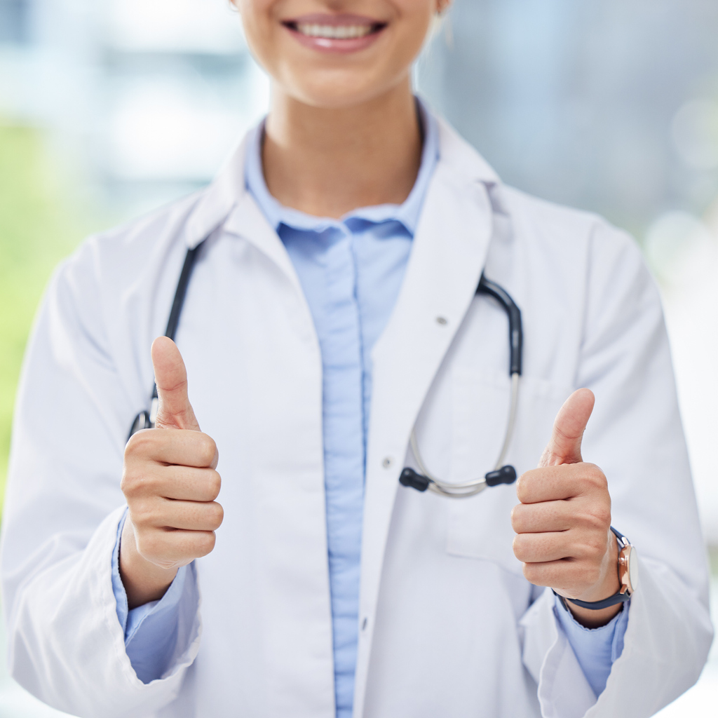 Doctor giving double thumbs up