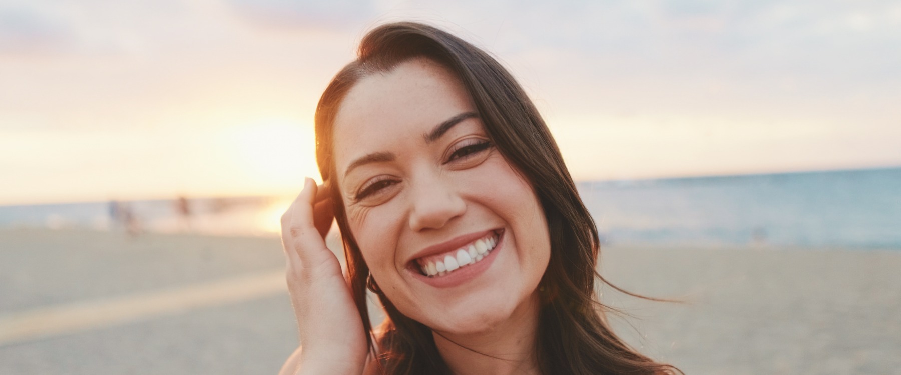 Happy woman smiling at the beach