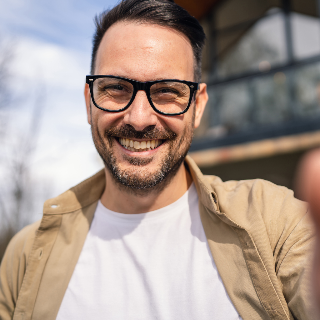 Smiling man with glasses