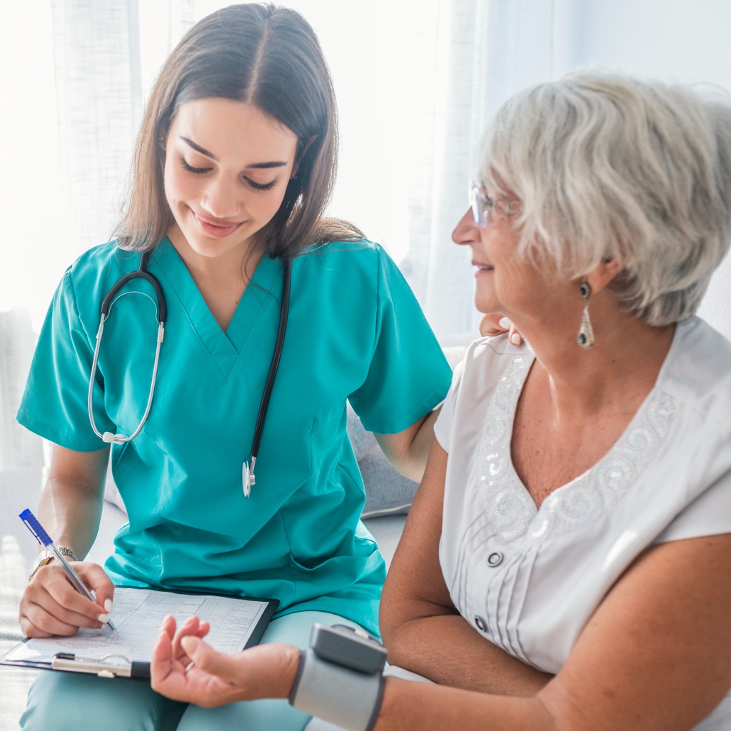 Older person and nurse examination