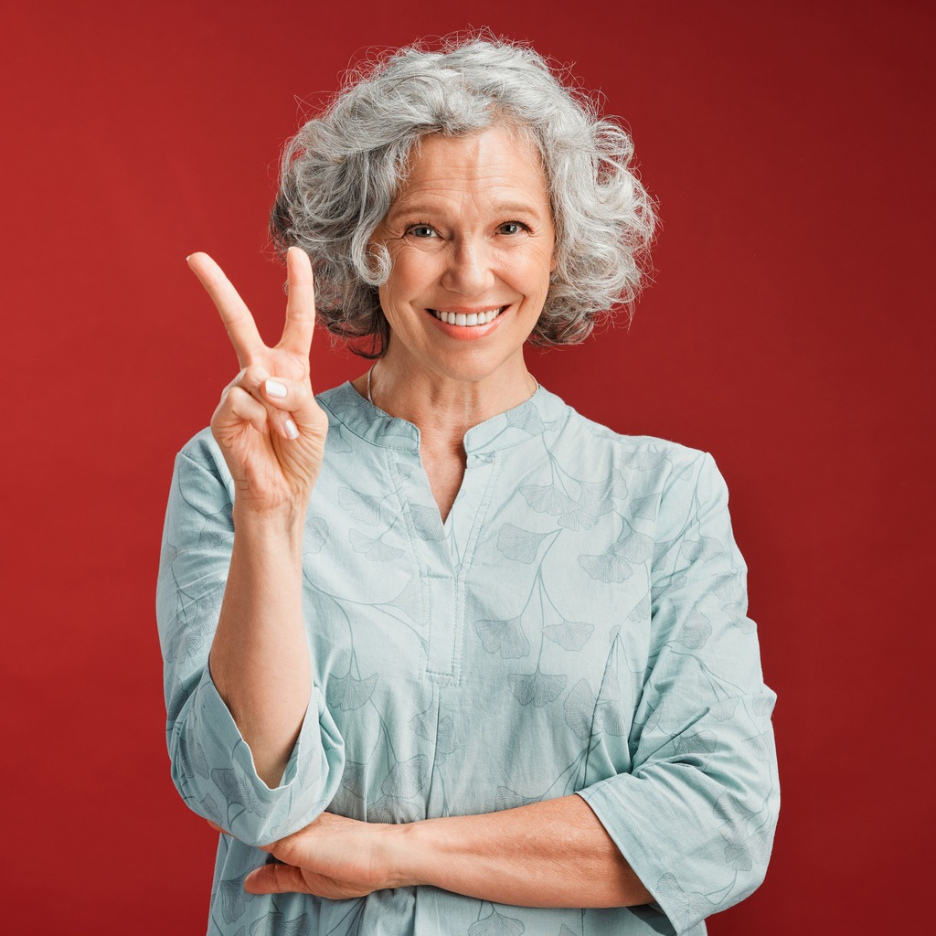 Senior woman peace sign