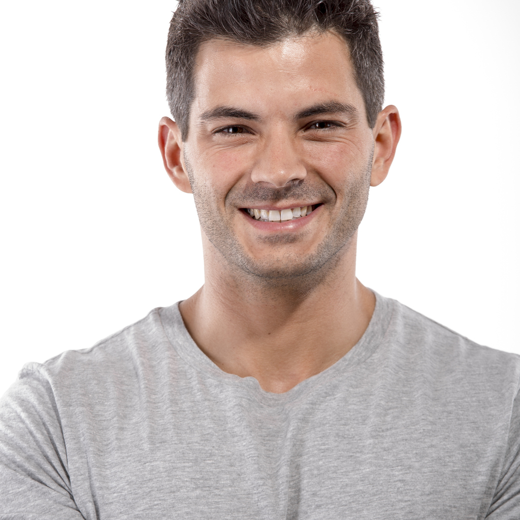 Smiling man in grey shirt
