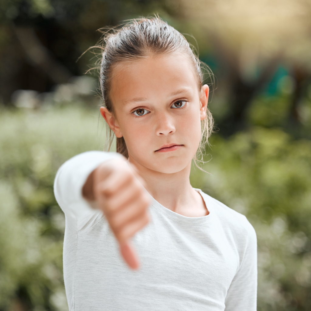 Kid giving thumbs down